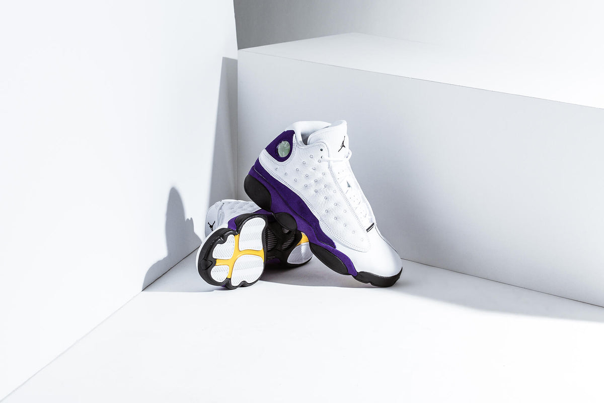 Air Jordan 13 Retro Youth "White/Black/Court Purple/University Gold" Available Now